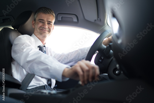 Businessman driving to work © StockPhotoPro