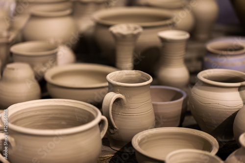 a lot of pottery on the table
