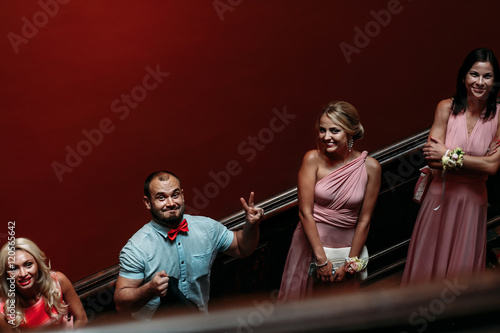 Women and man on the stairs