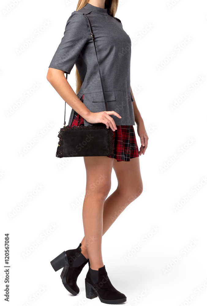 Woman holding a handbag isolated on white background Woman holding a handbag isolated on white background