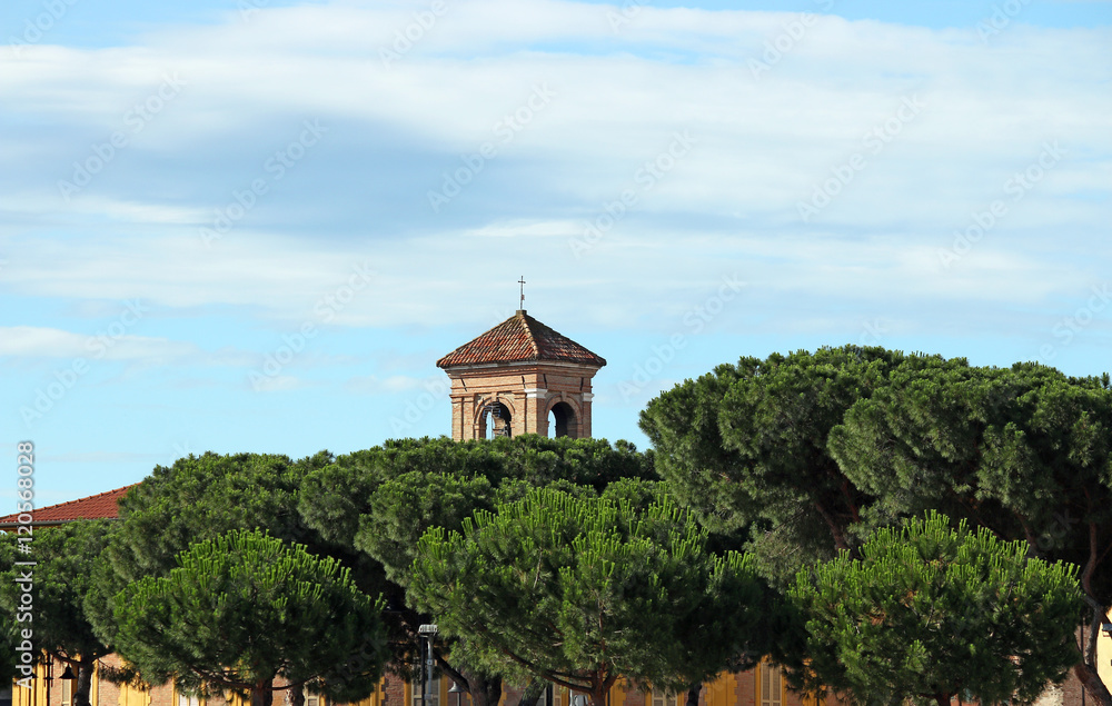old church tower and pine trees Rimini Italy