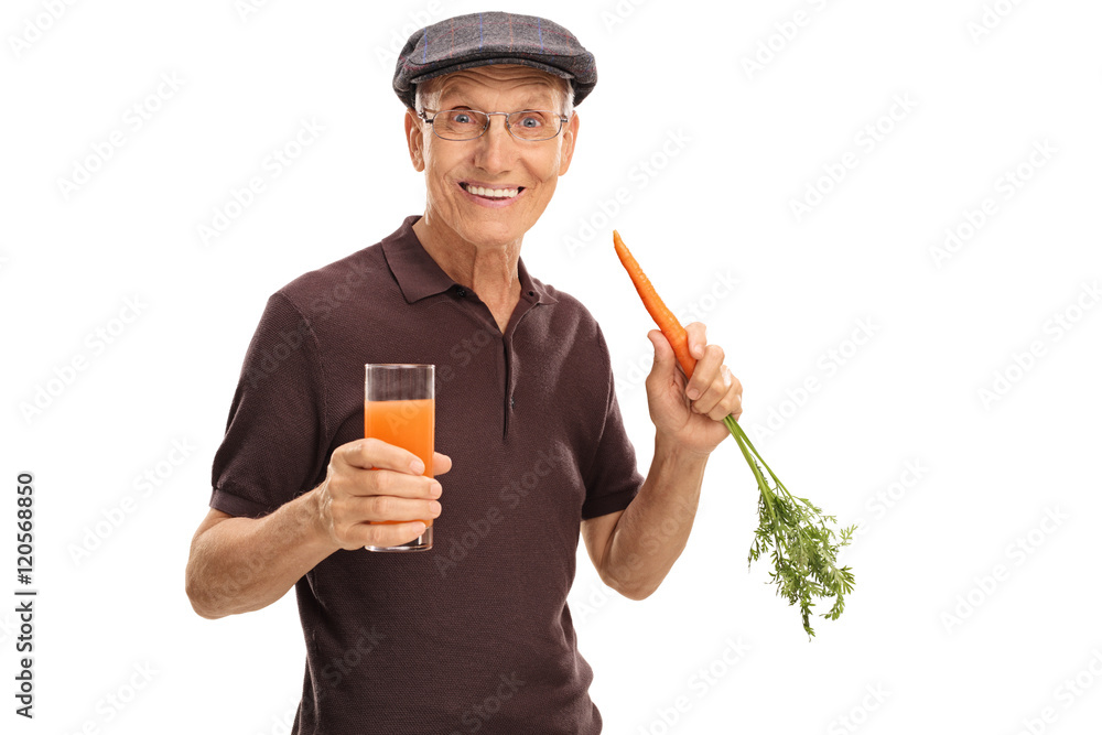 Man holding carrot and glass of juice Man holding carrot and glass of juice