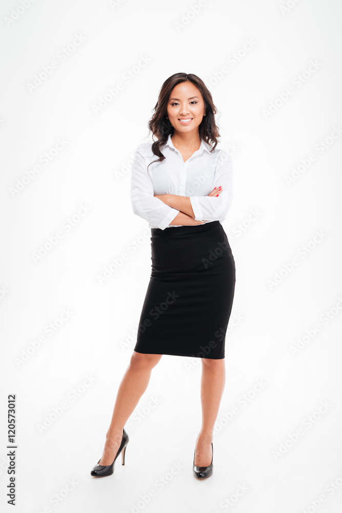Portrait of a smiling asian businesswoman standing with arms folded Portrait of a smiling asian businesswoman standing with arms folded