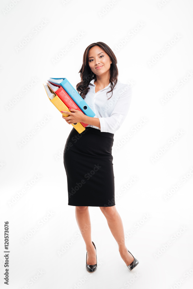 Smiling pretty young asian businesswoman holding folders with documents Smiling pretty young asian businesswoman holding folders with documents