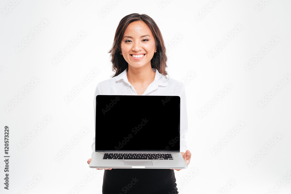 Beautiful smiling asian businesswoman showing laptop with blank screen Beautiful smiling asian businesswoman showing laptop with blank screen