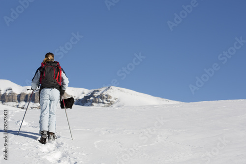 woman hiking with snowshoes