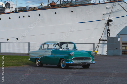 Classic car on the background of the ship
