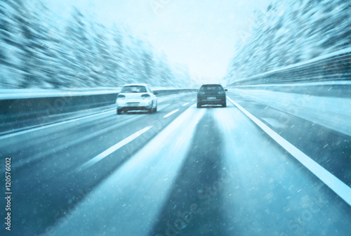 Photos Conceptual blurry safety car overtaking on snowy highway
