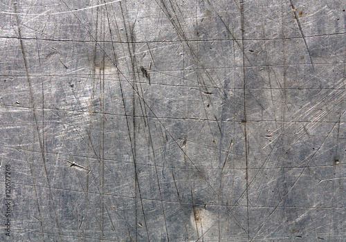 Photography Gray scratched metal surface.