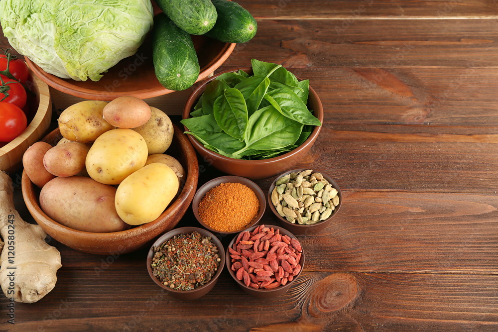 Vegetables and spices on wooden table Vegetables and spices on wooden table