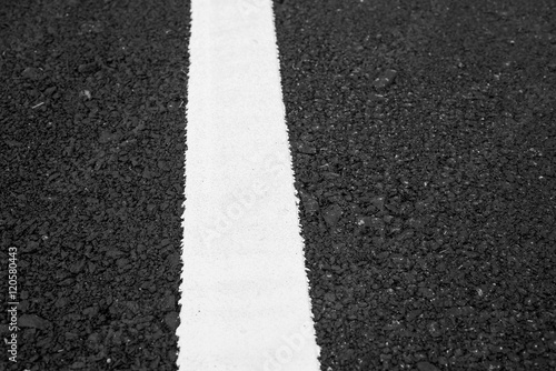 White line on black road texture background © anatskwong