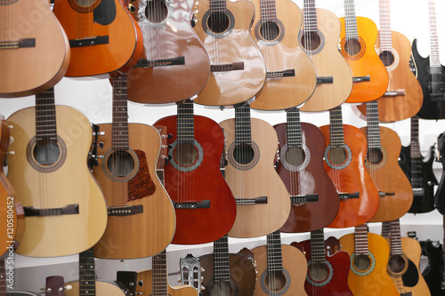 Guitars hanging on wall, closeup