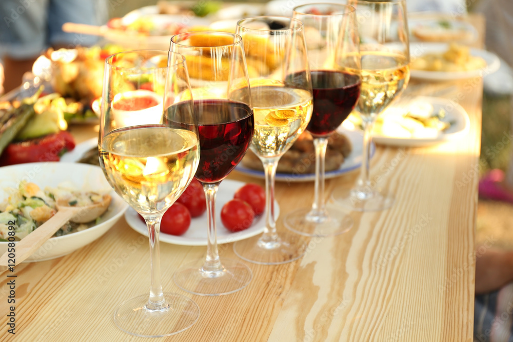 Glasses of different wine on wooden table Glasses of different wine on wooden table