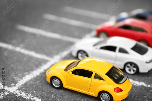 Close up of toy cars parking