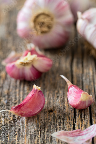 fresh garlic on wooden surface