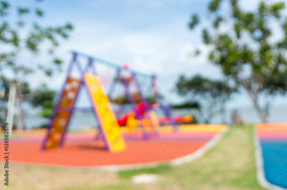 Blur of Colorful playground on yard in the park. Blur of Colorful playground on yard in the park.