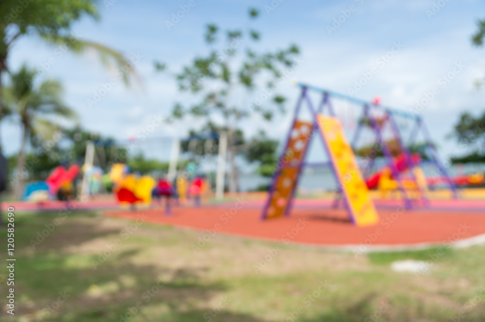 Blur of Colorful playground on yard in the park. Blur of Colorful playground on yard in the park.