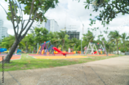 Blur of Colorful playground on yard in the park. © phollapat