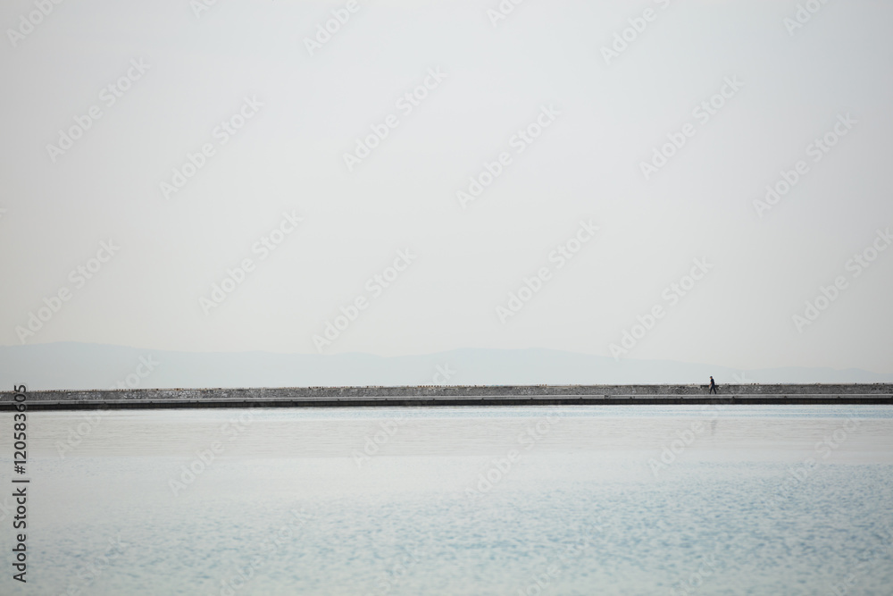 Silhouette of man on the pier.