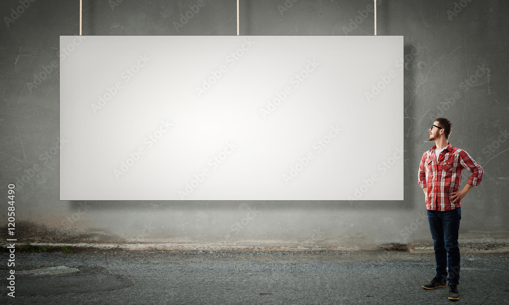 Hipster guy near banner . Mixed media Hipster guy near banner . Mixed media