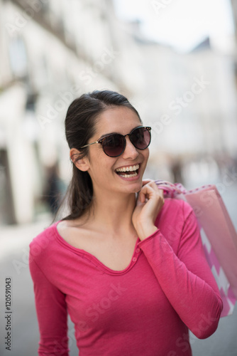 A beautiful woman walking and doing shopping in the streets