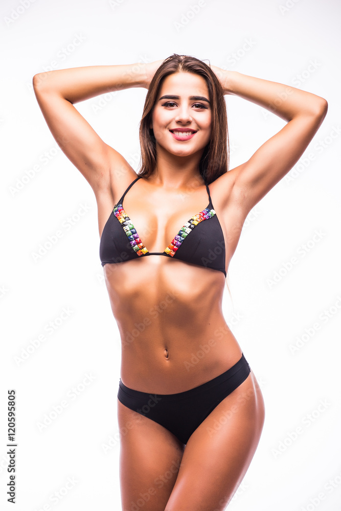 Woman in swimsuit with perfect abs, fit body Woman in swimsuit with perfect abs, fit body