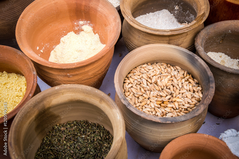 Slavic dry food products in an earthenware pots. Slavic dry food products in an earthenware pots.
