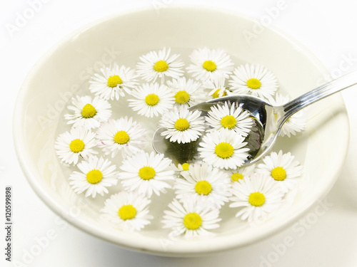 ceramic bowl with daisy flowers and spoon