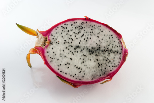 Dragon fruit cut in half on a white background closeup
