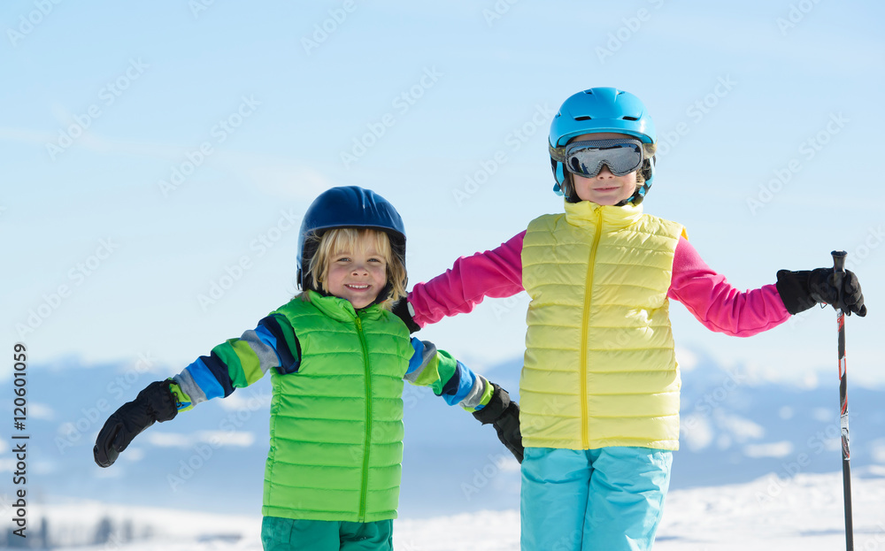 Skiing, winter fun,smiling children enjoying ski holiday on a sunny day
