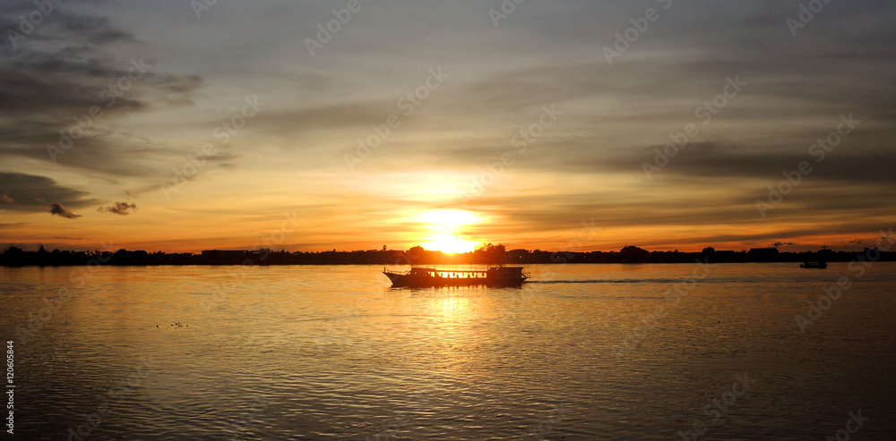 Boat cruising at sunset