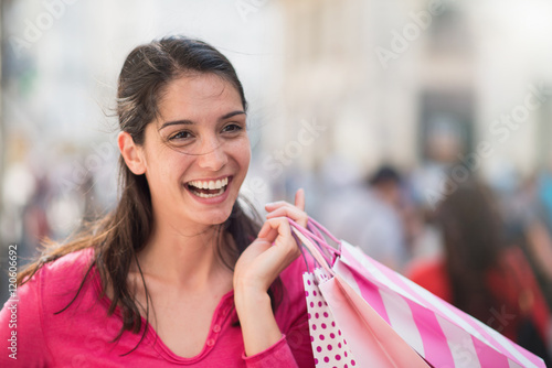A beautiful woman walking and doing shopping in the streets