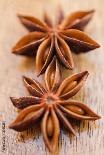 anise stars on a wood background closeup