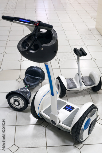 Three types of the gyroscooters on the floor. photo