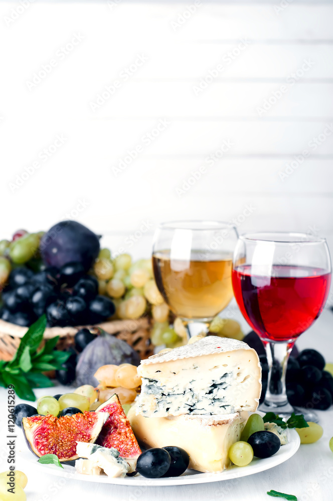 Wine, grape and cheese over white