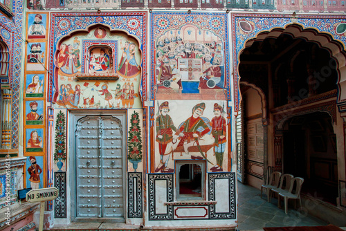 Murals in courtyard of old mansion in Rajasthan,  India photo