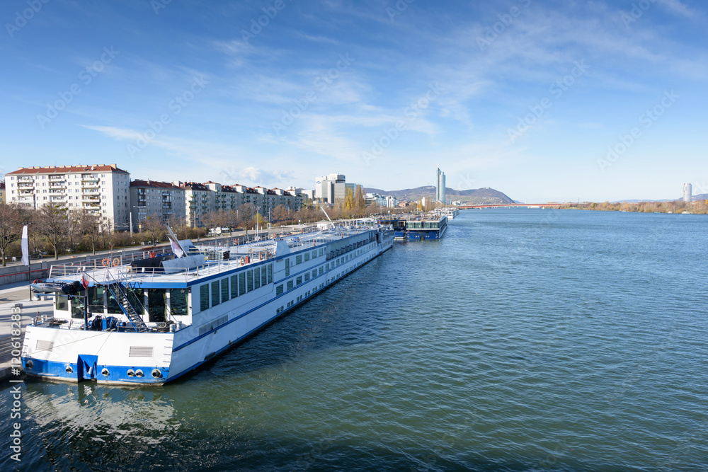 Danube river view with ferryboat in Vienna, Austria