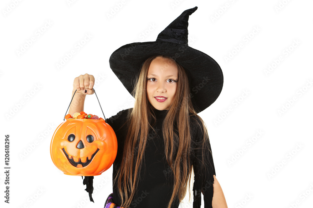 Beautiful girl witch and basket for candies on a white backgroun Beautiful girl witch and basket for candies on a white backgroun