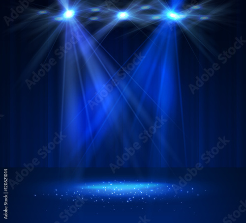Spotlight on stage with smoke and light.