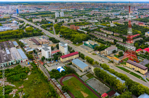 Tyumen, Russia - August 9, 2015: Bird eye view on bus station, prosecutor office of Central joint-stock company, TV towers and residential districts at summer