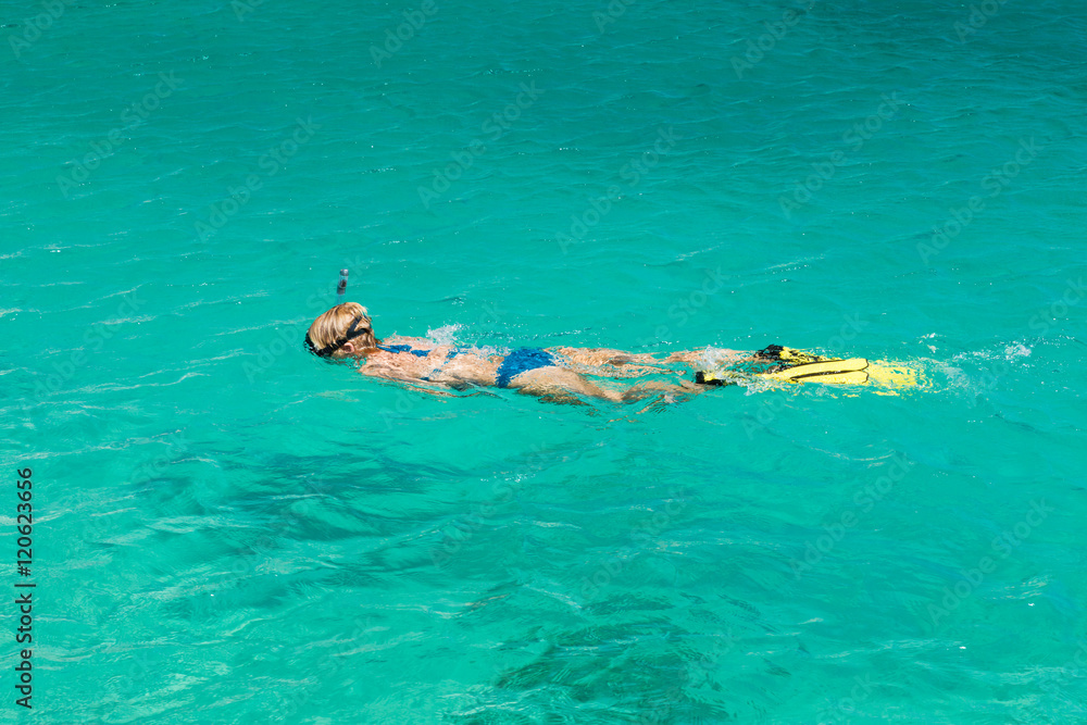 Swimmer with mask and pipe in the water