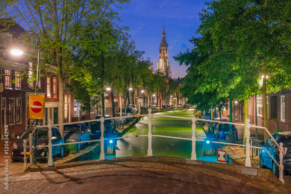 Night canal and Gothic Protestant Nieuwe Kerk church in Delft, Holland, Netherlands Night canal and Gothic Protestant Nieuwe Kerk church in Delft, Holland, Netherlands
