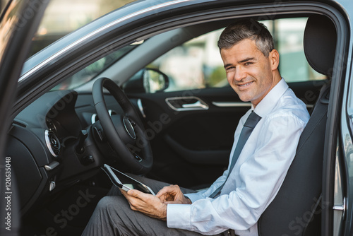 Businessman in his car © StockPhotoPro