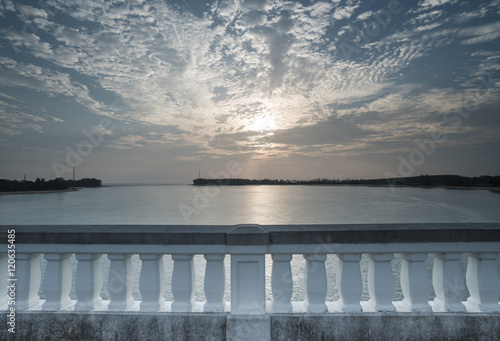 Fototapeta Naklejka Na Ścianę i Meble -  View of sea and beautiful sunset from white bridge