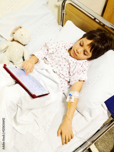 Naklejka Using tablet on hospital bed