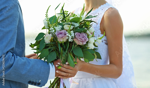 Happy wedding couple on riv...