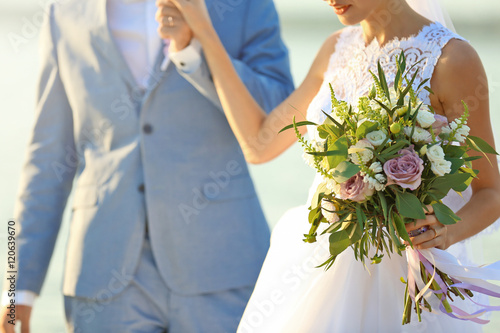 Happy wedding couple on riv...