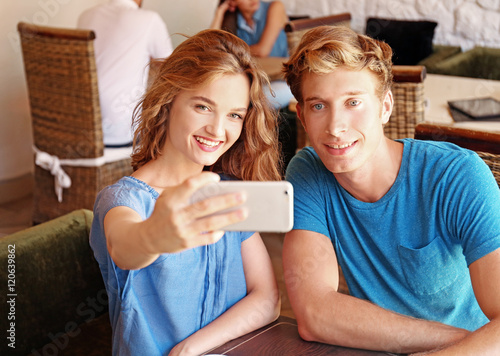 Happy couple taking selfie ...