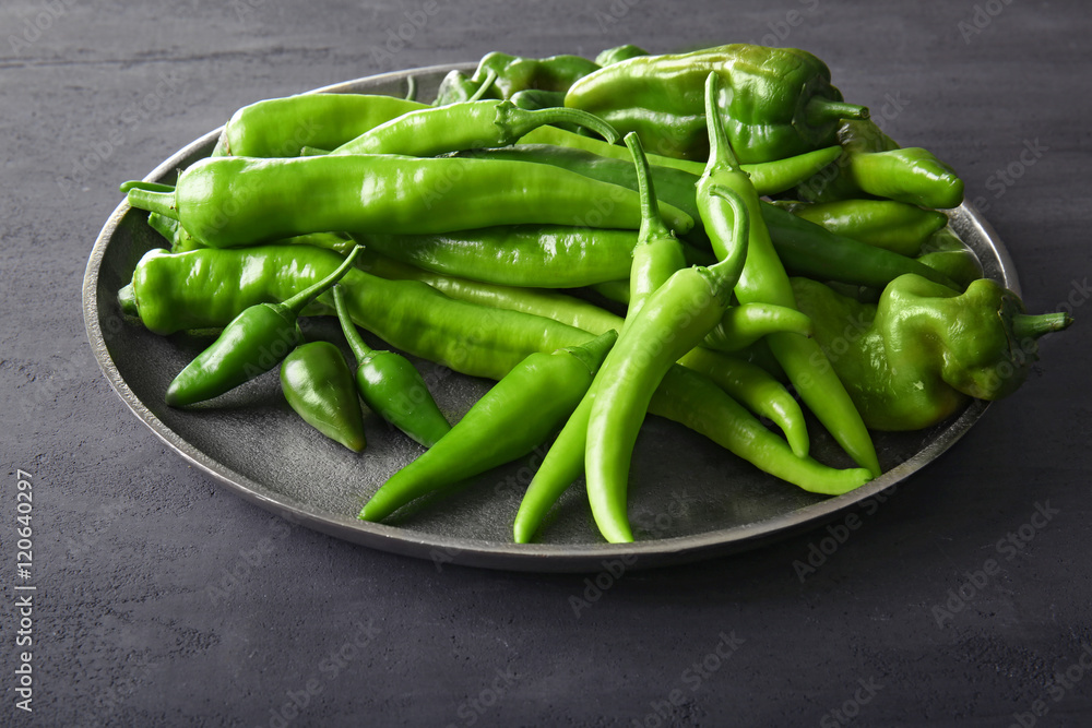 Green peppers on metal plate