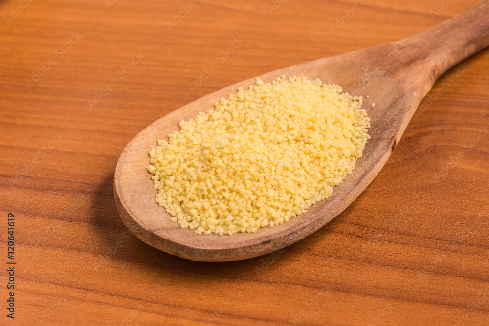 Ground Wheat into a spoon. Trigo para quibe. Kibbeh Ground Wheat into a spoon. Trigo para quibe. Kibbeh